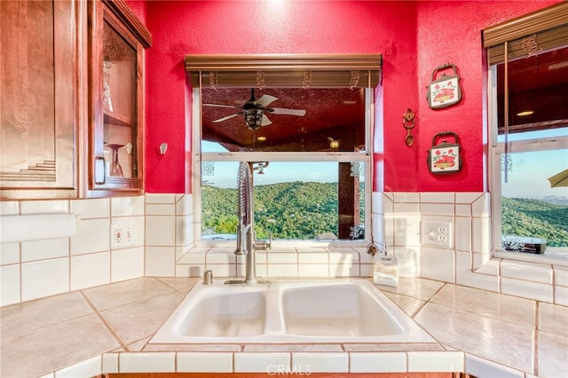 50806 Bramble Ln, Squaw Valley, CA 93675 - kitchen featuring ceiling fan, backsplash, tile counters, and a textured wall