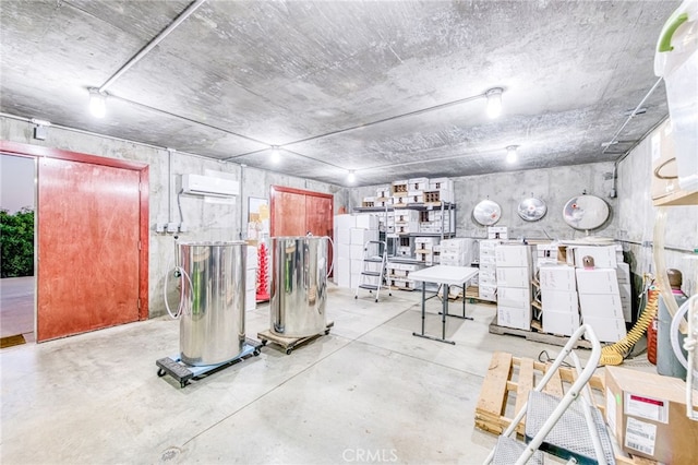 50806 Bramble Ln, Squaw Valley, CA 93675 - misc room with finished concrete floors and an AC wall unit