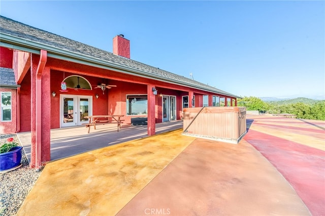 50806 Bramble Ln, Squaw Valley, CA 93675 - rear view of property with french doors, a chimney, a hot tub, and a patio