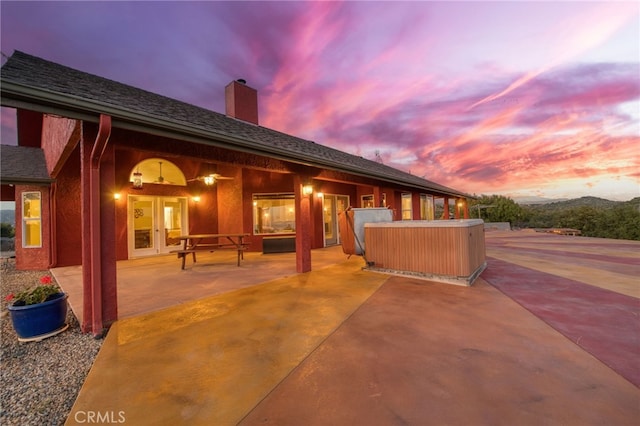 50806 Bramble Ln, Squaw Valley, CA 93675 - patio terrace at dusk featuring french doors and a patio area