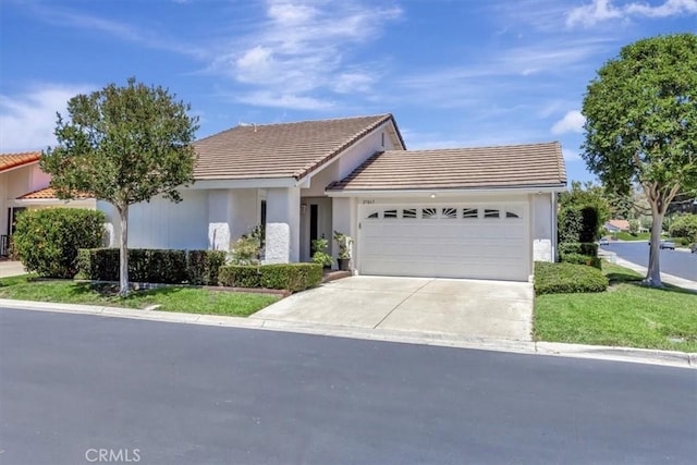 27865 Espinoza, Mission Viejo, CA 92692 - ranch-style house with a garage, a tile roof, driveway, and stucco siding