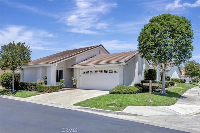 27865 Espinoza, Mission Viejo, CA 92692 - ranch-style home featuring an attached garage, concrete driveway, stucco siding, a front lawn, and a tile roof