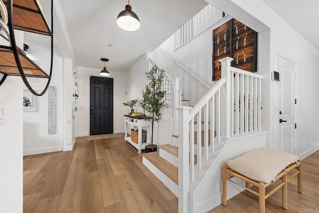 25444 Red Hawk Rd, Corona, CA 92883 - entryway featuring light wood finished floors, stairway, and baseboards