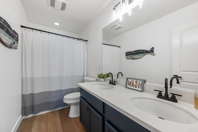 25444 Red Hawk Rd, Corona, CA 92883 - bathroom with toilet, double vanity, wood finished floors, and curtained shower