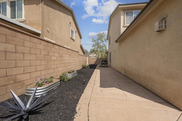 25444 Red Hawk Rd, Corona, CA 92883 - view of side of property featuring a fenced backyard, a patio area, and stucco siding
