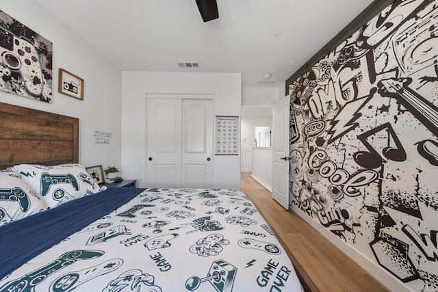 25444 Red Hawk Rd, Corona, CA 92883 - bedroom featuring a closet, light wood-type flooring, and a ceiling fan