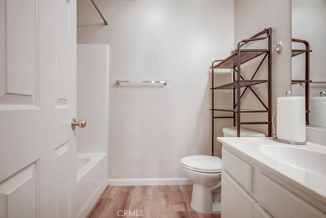 39723 Columbia Union Dr Unit A, Murrieta, CA 92563 - full bathroom featuring wood finished floors, vanity, toilet, shower / tub combination, and baseboards