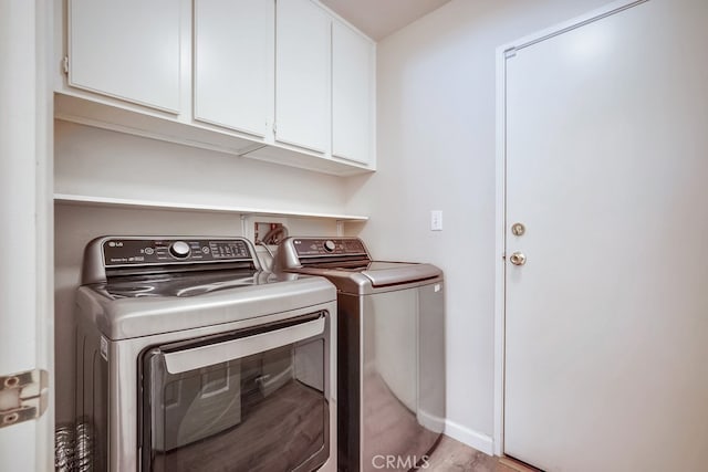 39723 Columbia Union Dr Unit A, Murrieta, CA 92563 - laundry room with independent washer and dryer, cabinet space, light wood-style flooring, and baseboards