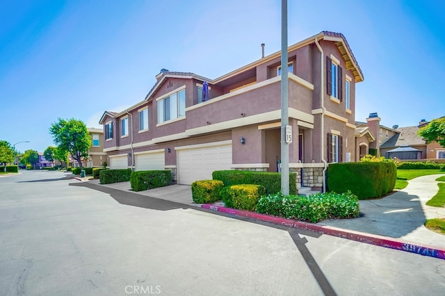 39723 Columbia Union Dr Unit A, Murrieta, CA 92563 - view of property with a garage and a residential view