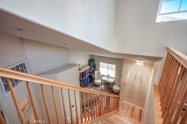 39723 Columbia Union Dr Unit A, Murrieta, CA 92563 - stairway featuring wood finished floors and a towering ceiling
