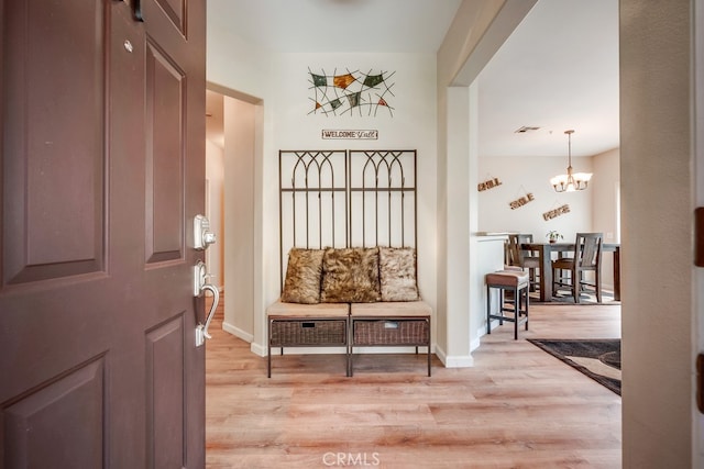 39723 Columbia Union Dr Unit A, Murrieta, CA 92563 - entryway featuring light wood finished floors, a chandelier, and baseboards