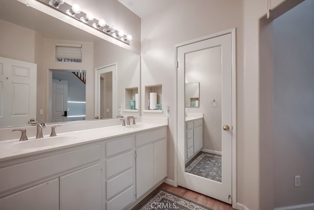 39723 Columbia Union Dr Unit A, Murrieta, CA 92563 - bathroom featuring double vanity and wood finished floors