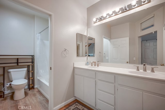 39723 Columbia Union Dr Unit A, Murrieta, CA 92563 - bathroom featuring toilet, wood finished floors, double vanity, and shower / bath combo with shower curtain