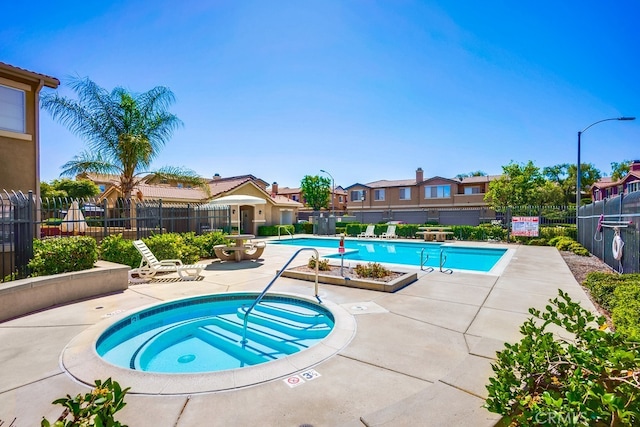 39723 Columbia Union Dr Unit A, Murrieta, CA 92563 - community pool with a hot tub, a patio area, and a residential view