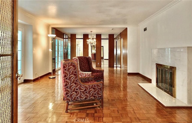 5510 E La Pasada St E, Long Beach, CA 90815 - living room with a chandelier, ornamental molding, baseboards, and a premium fireplace