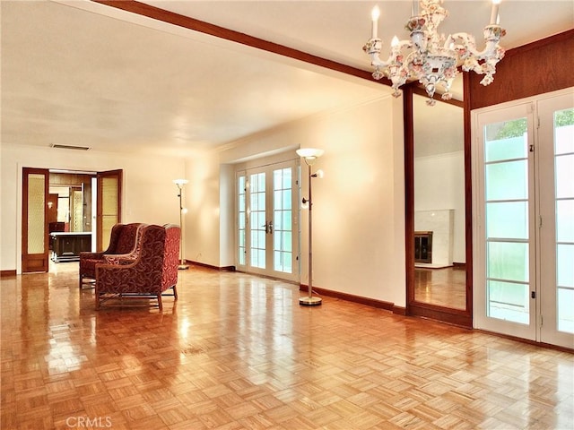 5510 E La Pasada St E, Long Beach, CA 90815 - living area featuring baseboards, french doors, and a chandelier