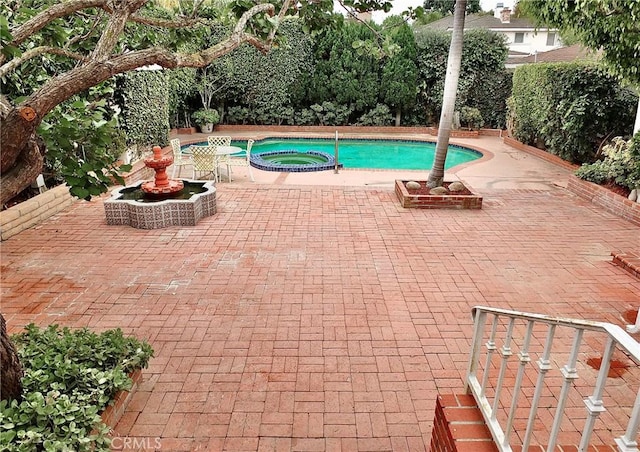 5510 E La Pasada St E, Long Beach, CA 90815 - view of pool featuring a pool with connected hot tub and a patio area