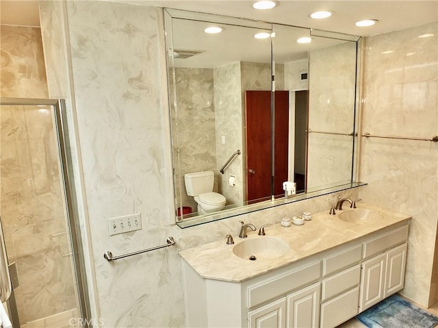 5510 E La Pasada St E, Long Beach, CA 90815 - bathroom with toilet, double vanity, recessed lighting, and a stall shower