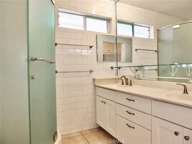 5510 E La Pasada St E, Long Beach, CA 90815 - bathroom with double vanity, a shower stall, and tile patterned floors