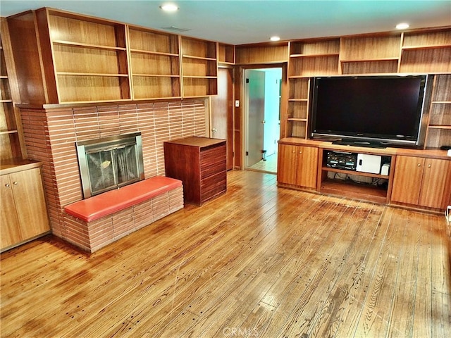 5510 E La Pasada St E, Long Beach, CA 90815 - unfurnished living room with light wood finished floors, a fireplace, and recessed lighting