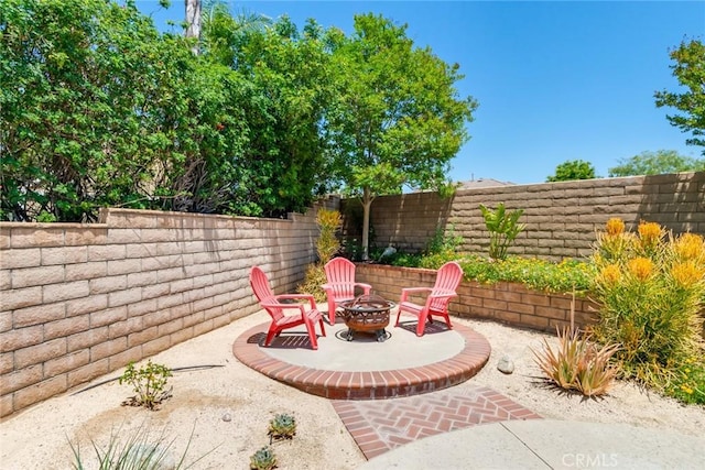 6909 Stanislaus Pl, Rancho Cucamonga, CA 91701 - fenced backyard with an outdoor fire pit and a patio