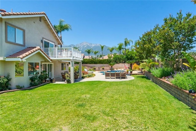 6909 Stanislaus Pl, Rancho Cucamonga, CA 91701 - view of yard featuring a mountain view, a patio area, and a balcony