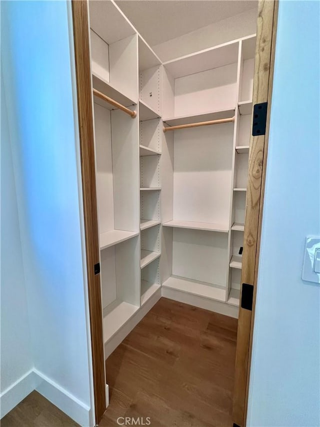 6829 Yolanda Ave, Reseda, CA 91335 - walk in closet featuring dark wood-style flooring