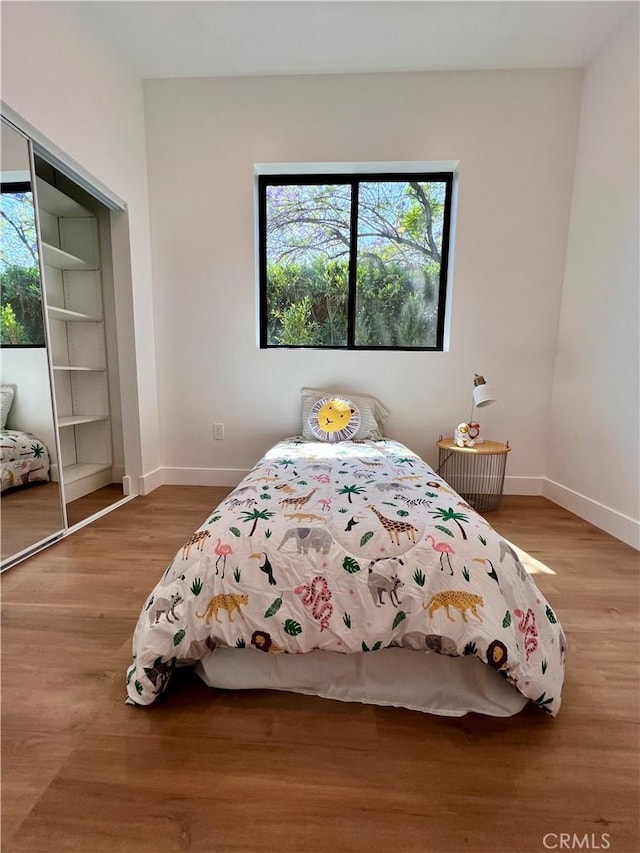 6829 Yolanda Ave, Reseda, CA 91335 - bedroom with baseboards and wood finished floors