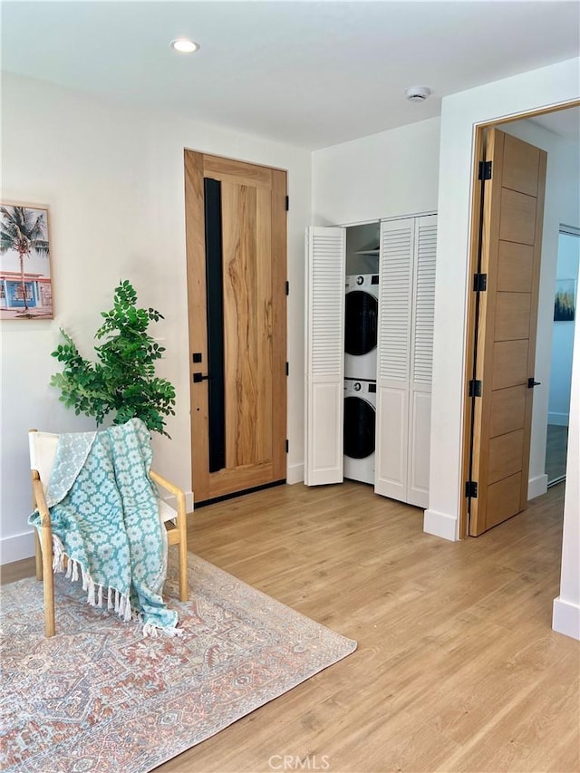 6829 Yolanda Ave, Reseda, CA 91335 - sitting room featuring stacked washer / dryer, light wood-type flooring, baseboards, and recessed lighting