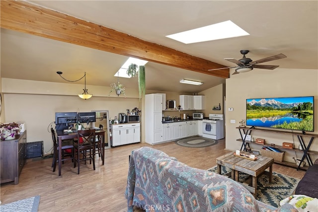 40125 Scanlon Rd, Temecula, CA 92592 - living area featuring a skylight, light wood finished floors, and a ceiling fan