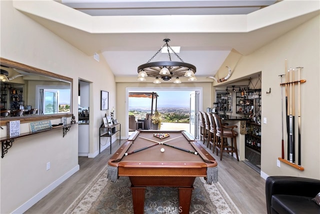 40125 Scanlon Rd, Temecula, CA 92592 - game room featuring a bar, wood finished floors, pool table, lofted ceiling, and baseboards