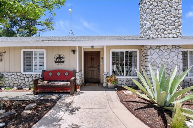 40125 Scanlon Rd, Temecula, CA 92592 - property entrance featuring stone siding, roof with shingles, and a porch