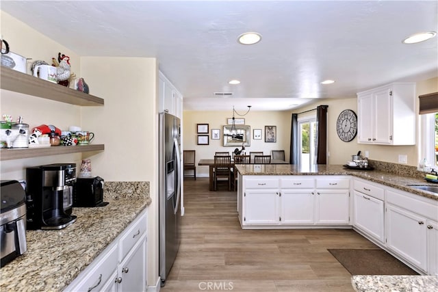 40125 Scanlon Rd, Temecula, CA 92592 - kitchen featuring stainless steel fridge with ice dispenser, a peninsula, white cabinetry, open shelves, and recessed lighting