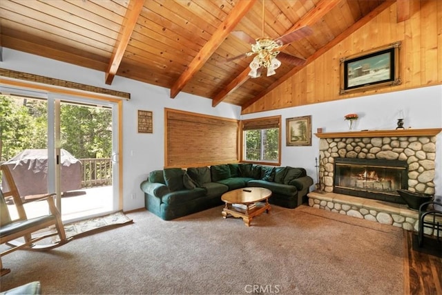 24755 Basel Dr, Crestline, CA 92325 - living room featuring carpet, healthy amount of natural light, wood ceiling with exposed beams, a fireplace, and ceiling fan