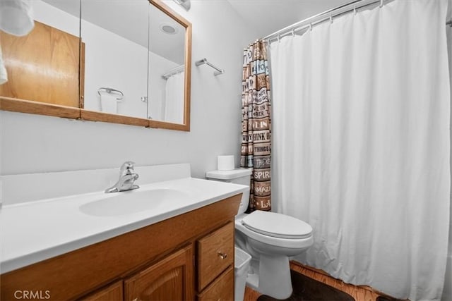 24755 Basel Dr, Crestline, CA 92325 - full bathroom with vanity, toilet, a shower with curtain, and wood finished floors