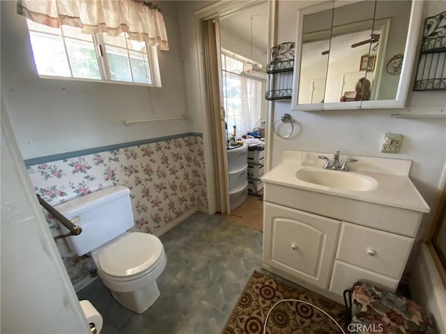9355 Ruffner Ave, Northridge, CA 91343 - bathroom with toilet, vanity, wallpapered walls, and baseboards