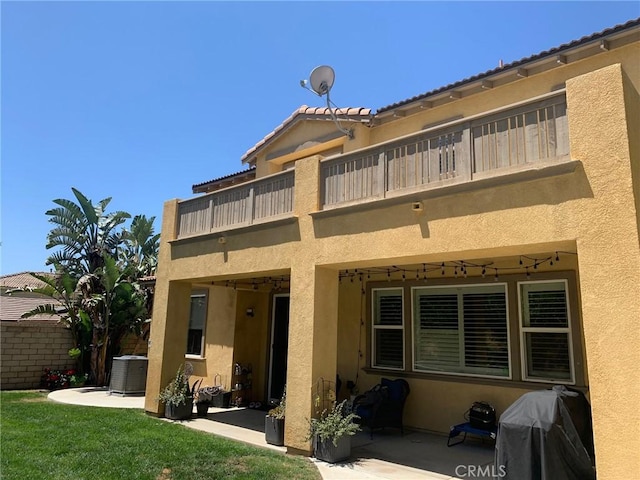 28626 Stonegate Ct, Valencia, CA 91354 - rear view of house featuring a balcony, stucco siding, a patio, and central air condition unit