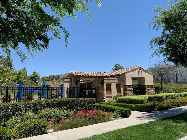28626 Stonegate Ct, Valencia, CA 91354 - view of front of property with stone siding, a tile roof, and stucco siding