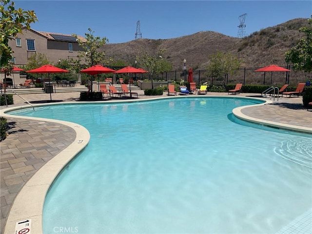 28626 Stonegate Ct, Valencia, CA 91354 - community pool featuring a mountain view and a patio area