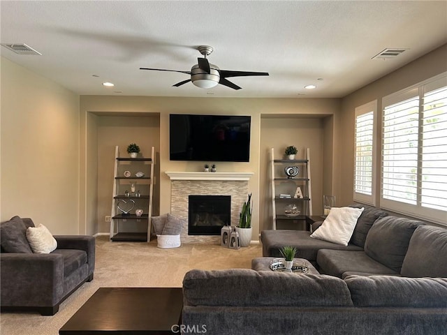 28626 Stonegate Ct, Valencia, CA 91354 - carpeted living area featuring ceiling fan, a stone fireplace, recessed lighting, and baseboards