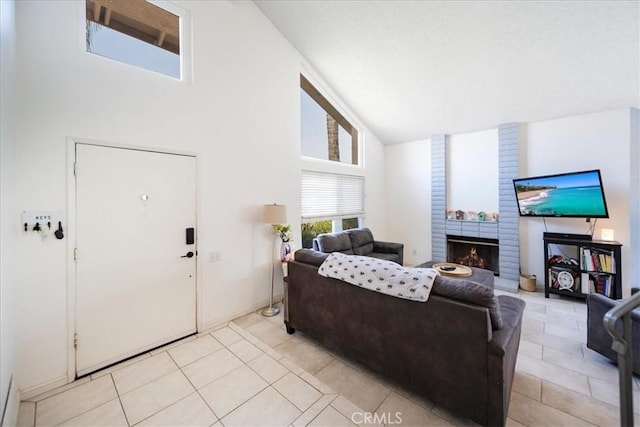 29870 Corte Cruzada, Menifee, CA 92584 - living area featuring high vaulted ceiling, light tile patterned flooring, and a fireplace