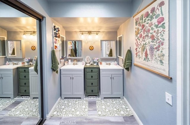 29870 Corte Cruzada, Menifee, CA 92584 - full bathroom featuring baseboards and two vanities
