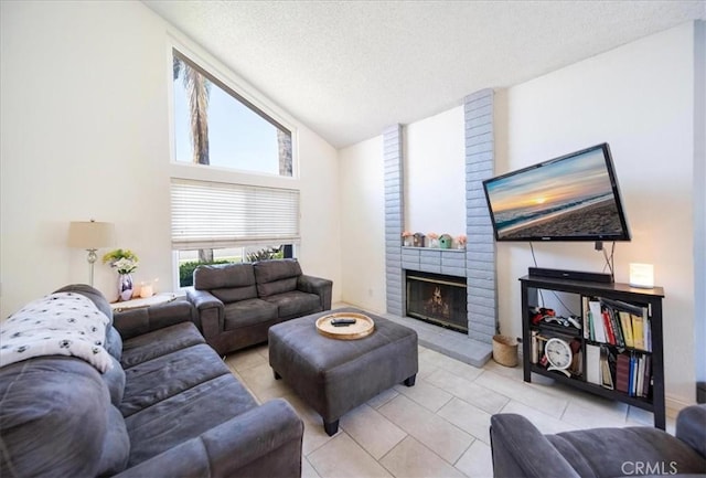 29870 Corte Cruzada, Menifee, CA 92584 - living area with light tile patterned flooring, a fireplace, a textured ceiling, and high vaulted ceiling
