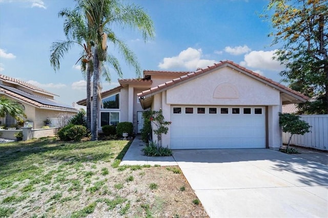 29870 Corte Cruzada, Menifee, CA 92584 - mediterranean / spanish house with a garage, stucco siding, driveway, and a tile roof