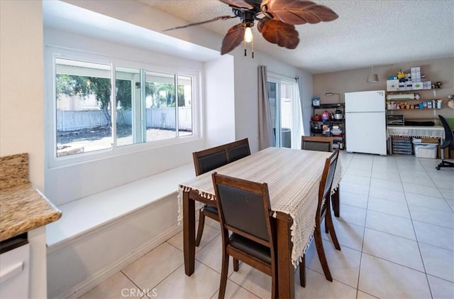 29870 Corte Cruzada, Menifee, CA 92584 - dining area featuring ceiling fan, light tile patterned floors, and a textured ceiling