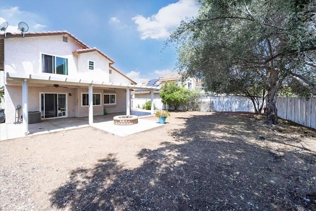 29870 Corte Cruzada, Menifee, CA 92584 - rear view of property featuring an outdoor fire pit, stucco siding, ceiling fan, a fenced backyard, and a patio