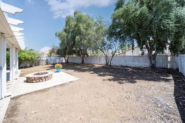 29870 Corte Cruzada, Menifee, CA 92584 - fenced backyard featuring a fire pit and a patio area