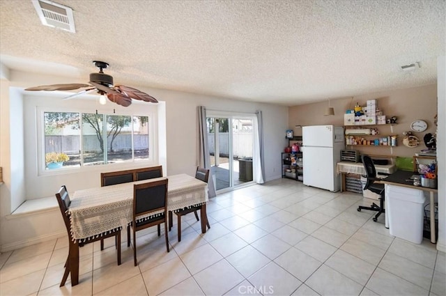 29870 Corte Cruzada, Menifee, CA 92584 - dining space featuring ceiling fan, an office area, a textured ceiling, and light tile patterned flooring