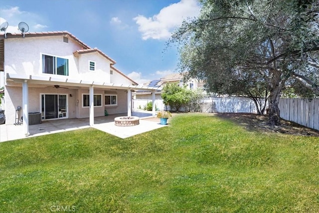 29870 Corte Cruzada, Menifee, CA 92584 - back of house with a fire pit, a ceiling fan, stucco siding, a patio, and a tile roof
