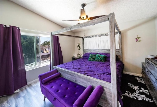 29870 Corte Cruzada, Menifee, CA 92584 - bedroom featuring a textured ceiling, wood finished floors, vaulted ceiling, ceiling fan, and baseboards